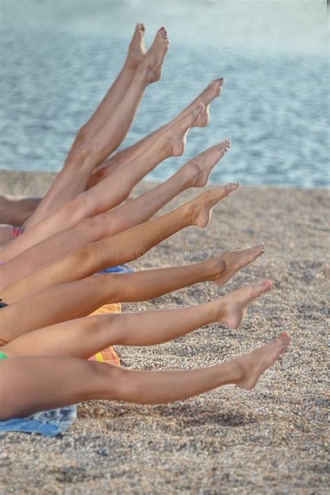Several Girls In Bikini Lying On Sandy Beach Stock Photo Image Of Breast Outside