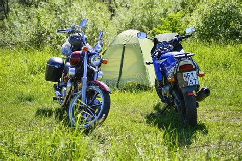 Motorcycles Red And Blue On Green Grass At The Festival Meeting Of