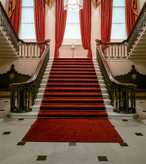 Inside Building With Red Carpet On Stairs Photo Free Staircase Image