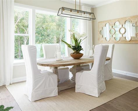 Shop for white chair slipcovers online at target. Oval Salvaged Wood Dining Table with White Slipcovered ...