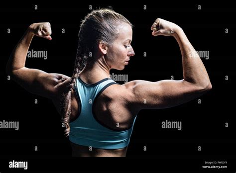 Athlete Woman Flexing Muscles Stock Photo Alamy