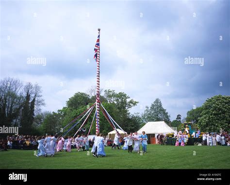Village Children Dancing Around The Maypole At Ickwell Green Watched By