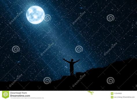 Silhouette Of Happy Man Enjoying The Night With Moon And Stars Stock