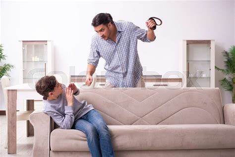 Father Beating And Punishing His Sone Stock Image Colourbox