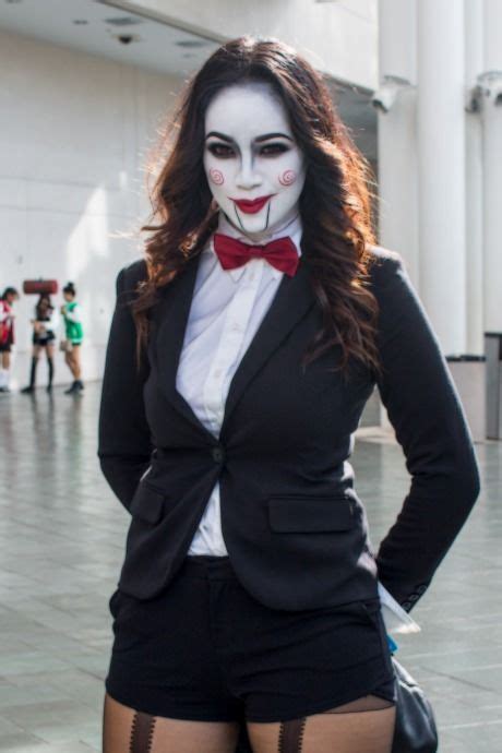a woman dressed up as the joker with her hands on her hips