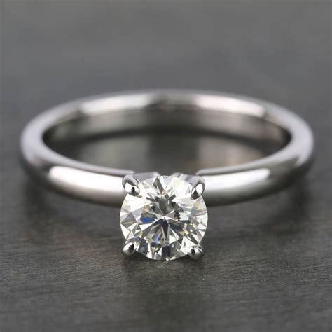Free earrings 2.0ct round cut in 14k white gold with purchase of any engagement ring the designer collection our designer collection will leave you breathless financing available buy now, pay later Round Classic Solitaire Diamond Engagement Ring (0.70 Carat)