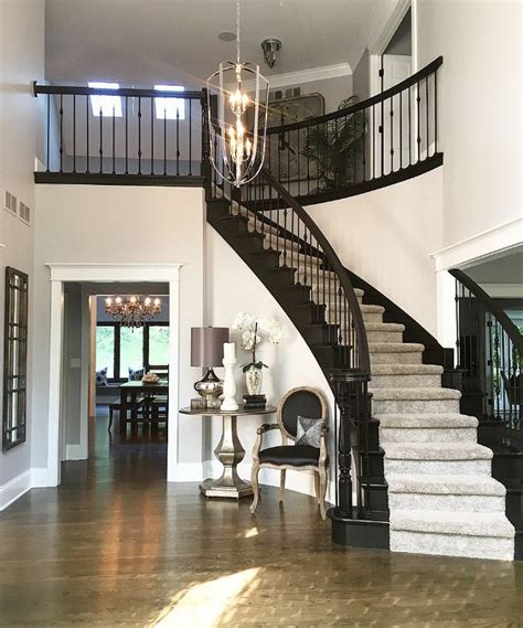 They can be colourful, decorative tune to black and white obviously, few of us have sweeping staircases like this one in our homes. Black staircase paint Black Beauty by Benjamin Moore with ...