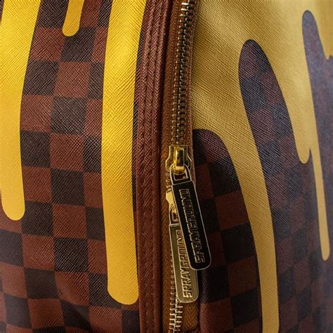 Sprayground Gold Checkered Drips Backpack Skateshop