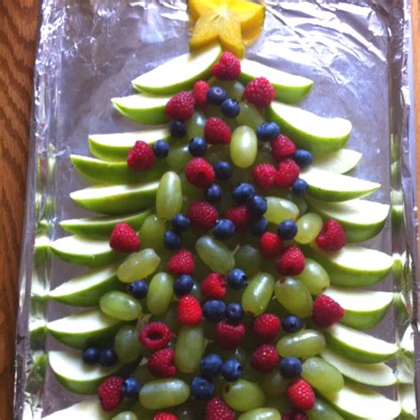 1 large pineapple 1 bunch green grapes—cut in half or quartered 1 bunch red grapes—cut in half or quartered 1 container strawberries—cut in half 1/4 watermelon toothpicks cookie cutters. Christmas tree fruit tray. | yummies! | Pinterest