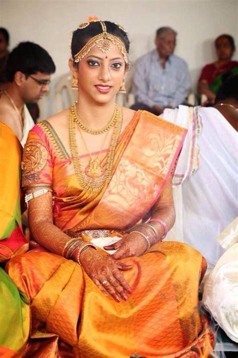 traditional south indian bride wearing bridal saree and jewellery muhurat look makeup by swank