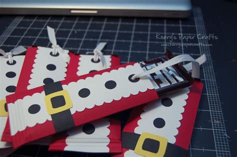 Find out how to make the craft here. Santa Chocolate Bar Wraps | Fun Family Crafts