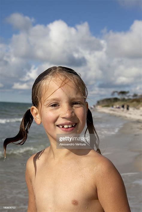 Portrait Of Young Girl On Beach Bildbanksbilder Getty Images
