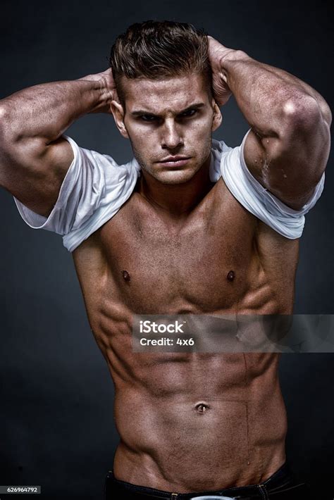 Muscular Man Giving A Pose Stock Photo Download Image Now 20 24