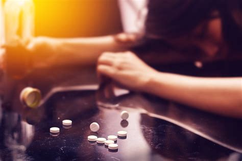 Overdose Drug Addiction Problem Concept Several Pill Spilled On Table