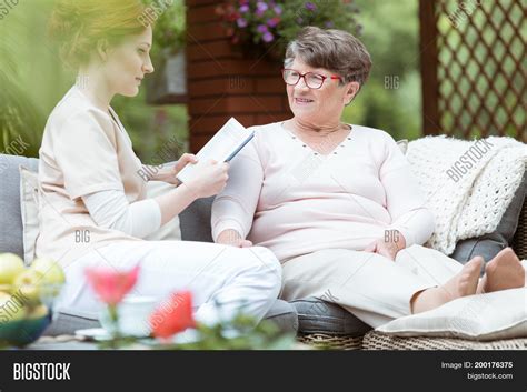 Caregiver Reading Image And Photo Free Trial Bigstock