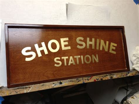 A Shoe Shine Station Sign On The Wall In A Shop Or Office Area With