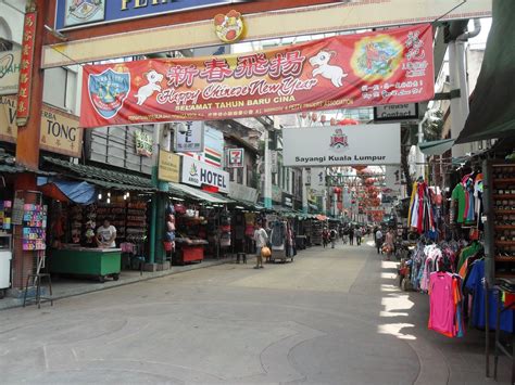 Drink, eat and shop in the petaling street market. Jalan Petaling Chinese Market, Petaling Street, Kuala ...