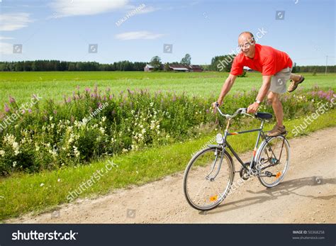 The best way to avoid injury is to find a natural angle for the both of you and then match him. Man Riding A Bicycle On A Funny Way Stock Photo 50368258 ...