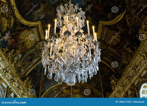 Closeup Shot Of Golden Ceiling And Crystal Chandeliers In The Palace Of