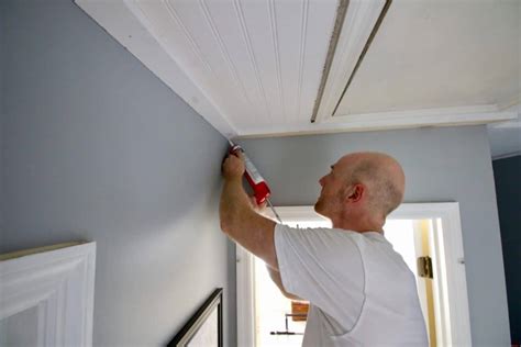 Nothing dates a home faster than a popcorn ceiling. How to Cover Popcorn Ceilings with Beadboard