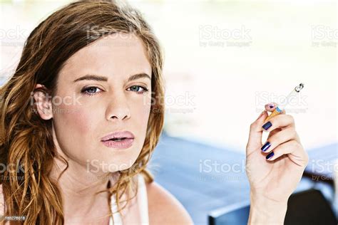 Beautiful Young Woman Smoking Cigarette Stock Photo Download Image