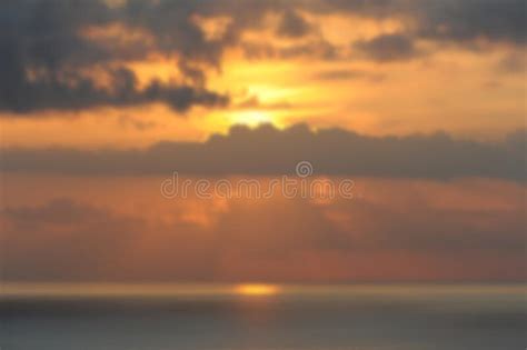 Sunset Light With Stormy Clouds In Praia Da Coelha Or Rabbit Beach In