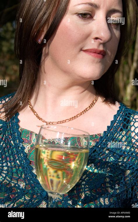 Beautiful Irish Woman In Evening Dress And Drinking White Wine Stock