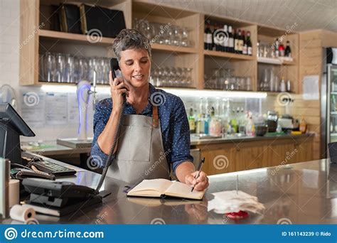 Coffee Shop Worker Taking Order Over Phone Stock Image Image Of