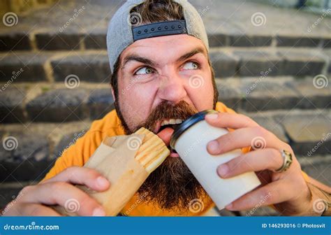 Snack For Good Mood Street Food Concept Man Bearded Eat Tasty Sausage And Drink Paper Cup