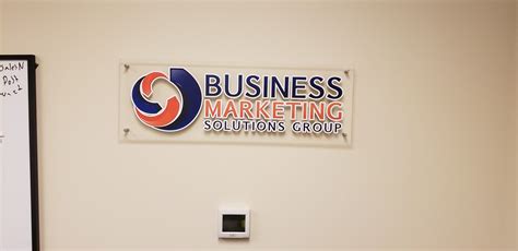 Company Logo Printed And Applied To Clear Acrylic And Mounted To The