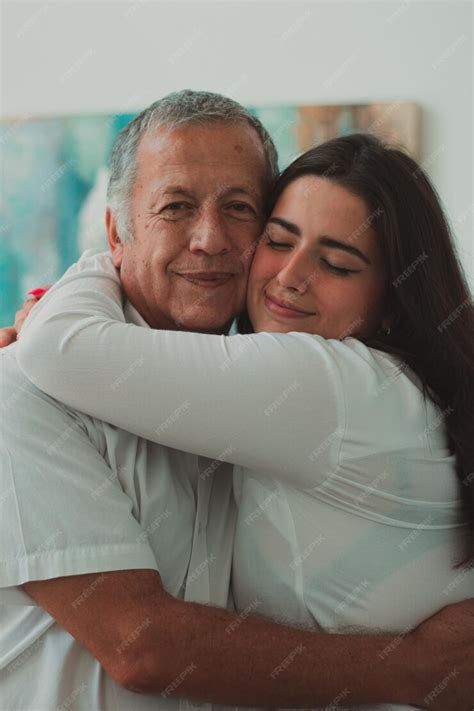 Premium Photo Granddaughter Hugging Her Happy Grandfather