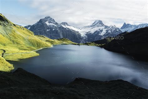 Picturesque View On Bachalpsee Lake In Swiss Alps Mountains Stock Photo
