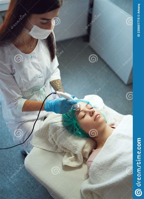 A Professional Cosmetologist Performs An Ultrasonic Phonophoresis