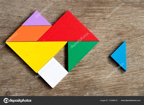 Colorful Tangram Puzzle In Heart Shape Wait To Fulfill On Wood