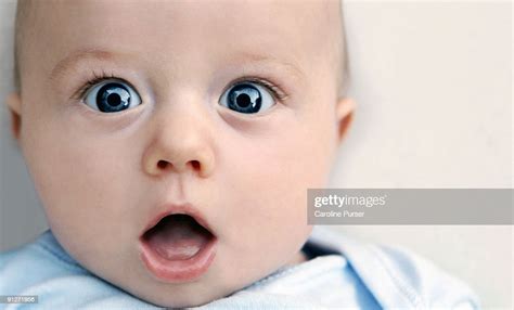 Surprised Baby Boy Looking At Camera High Res Stock Photo Getty Images