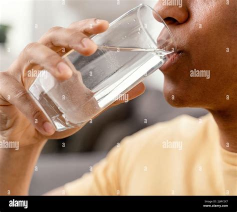 Portrait Man Home Drinking Glass Water Stock Photo Alamy