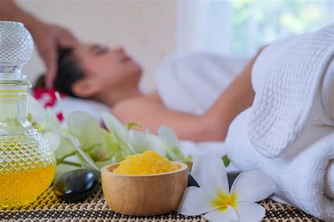premium photo spa treatment set and aromatic massage oil on bed massage thai setting for
