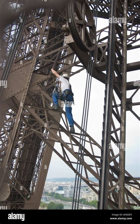 Man Climbing The Eiffel Tower Paris France Stock Photo Alamy