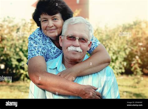 Loving Mature Cople Hugs On A Summer Day In The Parksenior Couple Are