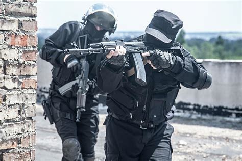 Two Spec Ops Soldiers In Black Uniform Photograph By Oleg Zabielin