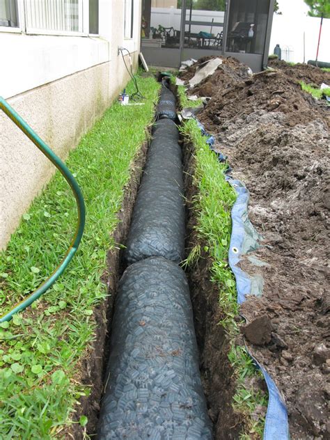 Digging can certainly be done by hand and it will involve quite a bit less it is up to you to decide how much time and money go into keeping that runoff water from collecting in your yard. Landscape drainage, French drain, French drain installation