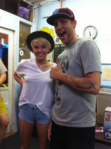 Miley Cyrus Pokies Pop Out Taking Pics With Her Fans