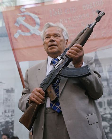 Russian Weapon Designer Mikhail Kalashnikov Is Shown Posing With The