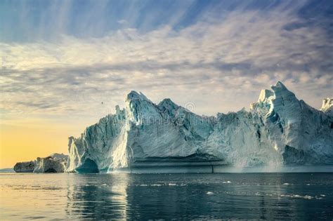 Greenland Ilulissat Glaciers At Ocean At Polar Night With Bird Stock
