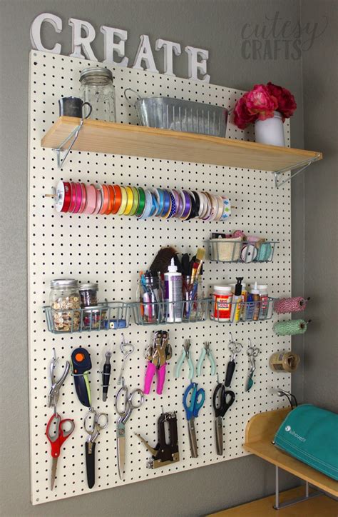 I think the splurge on the ikea buckets & rod system is so beautiful & it really stands out. Easy Craft Room Ideas - Cutesy Crafts