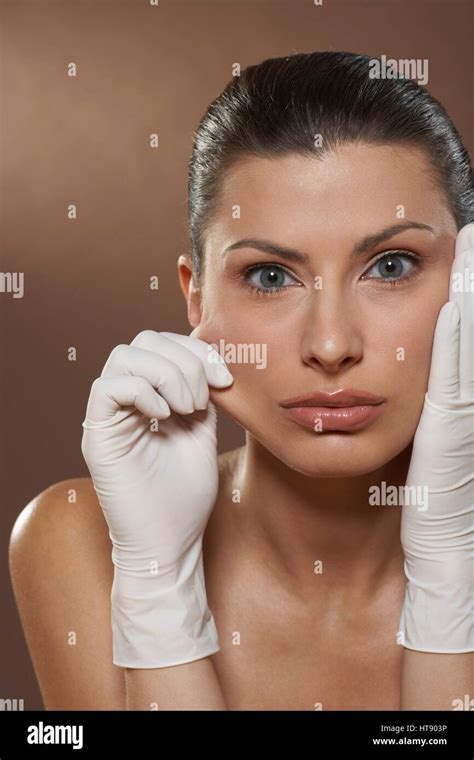 Woman Pinching Cheek Stock Photo Alamy