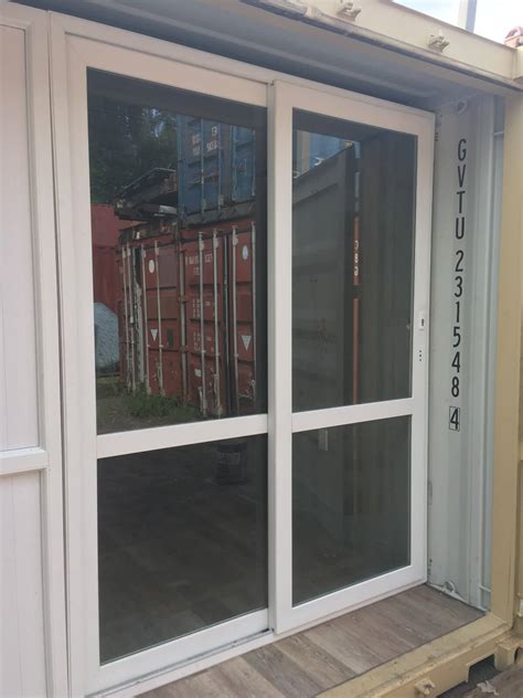 Besides throwing open the interiors of the home to the outside, glass doors have many other benefits. Shipping Container Sliding Glass Door - Container Modifications - CMG
