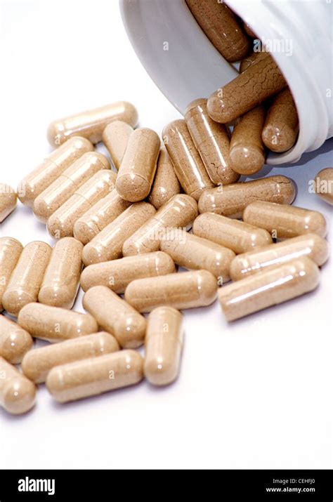 Closeup Image Of Brown Pills Roughage On The White Background Stock