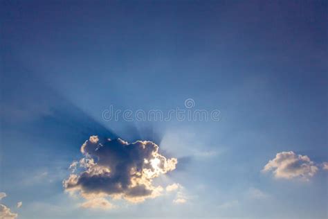 Ray Of Crepuscular Dazzling Sun Light Shine Through The Gap Among Cloud