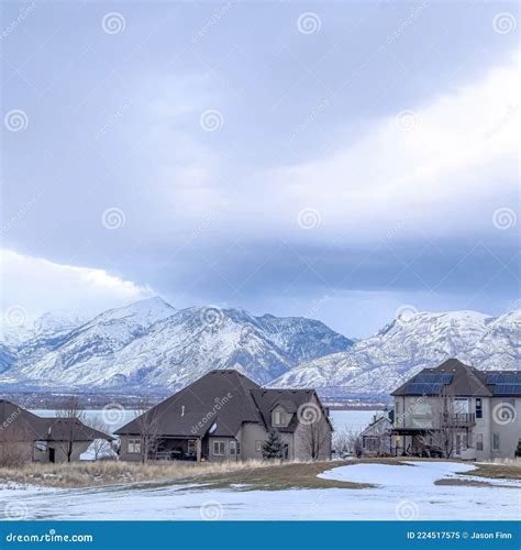 Square Lake Front Homes On A Snowy Neighborhood Setting With Wasatch